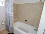 master bathroom with tub/shower combo